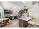 Modern kitchen boasts sleek cabinetry, stainless steel appliances, and a stylish breakfast bar at 17548 E Wesley Pl, Aurora, CO 80013