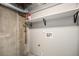 Unfinished laundry room with water hookups and fire extinguisher on the wall at 17548 E Wesley Pl, Aurora, CO 80013