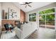 Living room boasts a brick fireplace, vaulted ceilings, hardwood floors, and access to deck at 17548 E Wesley Pl, Aurora, CO 80013