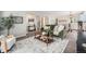 Open-concept living space with stylish furnishings, elegant decor, and plenty of natural light at 17548 E Wesley Pl, Aurora, CO 80013