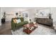 Stylish living room featuring modern decor, a comfortable sofa, and an elegant accent cabinet at 17548 E Wesley Pl, Aurora, CO 80013