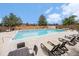 Inviting outdoor pool with lounge chairs, perfect for relaxing and enjoying the community amenities at 17548 E Wesley Pl, Aurora, CO 80013