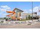 View of community waterpark with slides, recreation center and manicured landscaping at 17548 E Wesley Pl, Aurora, CO 80013