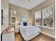 Comfortable bedroom with hardwood floors, natural light, and tasteful decor at 668 E Dry Creek Cir, Littleton, CO 80122