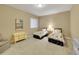 Cozy bedroom with neutral carpeting and walls, featuring two twin beds and matching décor at 668 E Dry Creek Cir, Littleton, CO 80122