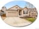 Charming two-story home with a two-car garage and well-manicured lawn, situated in a desirable neighborhood at 668 E Dry Creek Cir, Littleton, CO 80122