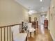 Welcoming foyer area with hardwood floors and stylish furniture and decor at 668 E Dry Creek Cir, Littleton, CO 80122