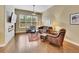 Stylish living room with hardwood floors, a modern fireplace, comfortable seating, and ample natural light at 668 E Dry Creek Cir, Littleton, CO 80122