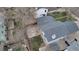Aerial view of the home highlighting the roof, backyard patio, and landscaping at 45 Pierce St, Lakewood, CO 80226