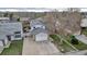 Aerial view of home with spacious driveway, front lawn, and well maintained landscaping at 45 Pierce St, Lakewood, CO 80226