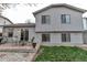 Backyard of home features a patio, chairs and a small grassy area at 45 Pierce St, Lakewood, CO 80226