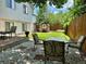 Serene backyard with patio, landscaped garden, stone oven, outdoor dining, and privacy fence at 45 Pierce St, Lakewood, CO 80226