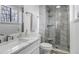 Modern bathroom featuring a glass-enclosed shower with unique tiling at 45 Pierce St, Lakewood, CO 80226
