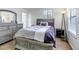 Bright bedroom with neutral paint, ensuite bath, and new wood flooring at 45 Pierce St, Lakewood, CO 80226