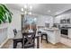 Modern kitchen with dining area, stainless steel appliances and a slider to the patio at 45 Pierce St, Lakewood, CO 80226
