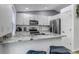 Bright, modern kitchen with white cabinets, stainless steel appliances, and granite countertops at 45 Pierce St, Lakewood, CO 80226