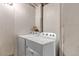 A well-lit laundry room featuring a white washer and dryer at 45 Pierce St, Lakewood, CO 80226