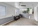 Neutral living room with plush carpet, large window and access to dining area at 45 Pierce St, Lakewood, CO 80226