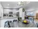 Open concept kitchen and living room with pendant lighting, breakfast bar and comfortable seating at 45 Pierce St, Lakewood, CO 80226