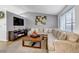Comfortable living room featuring a fireplace, TV, large sectional sofa, and stylish decor at 45 Pierce St, Lakewood, CO 80226