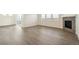 Bright living room featuring hardwood floors, a modern fireplace, and a view of the exterior at 1842 Chaffee Crest Dr, Berthoud, CO 80513