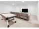 Finished basement featuring an air hockey table, comfortable seating, and a large TV at 6677 Crossbridge Cir, Castle Rock, CO 80108