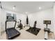 Basement workout room with treadmill, bike, weights and punching bag at 6677 Crossbridge Cir, Castle Rock, CO 80108