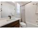 This bathroom features a well-lit vanity, a shower-tub combo, and neutral finishes throughout at 6677 Crossbridge Cir, Castle Rock, CO 80108