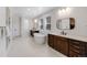 Luxurious bathroom with double vanity, soaking tub, separate shower, and neutral tile flooring at 6677 Crossbridge Cir, Castle Rock, CO 80108