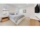 Minimalist bedroom with a comfortable bed, side tables, and ample natural light from shuttered windows at 6677 Crossbridge Cir, Castle Rock, CO 80108