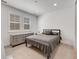 Cozy bedroom featuring neutral walls and carpet and large windows to allow ample natural light at 6677 Crossbridge Cir, Castle Rock, CO 80108