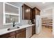 Bright kitchen featuring wooden cabinets, white countertops, stainless steel appliances, and a walk-in pantry at 6677 Crossbridge Cir, Castle Rock, CO 80108