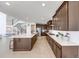 Open concept kitchen with a large island, wooden cabinets, and stainless steel appliances at 6677 Crossbridge Cir, Castle Rock, CO 80108