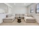 Bright living room with a large sectional, and windows that offer plenty of natural light at 6677 Crossbridge Cir, Castle Rock, CO 80108