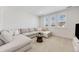 Bright living room with a large sectional, and windows that offer plenty of natural light at 6677 Crossbridge Cir, Castle Rock, CO 80108