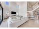 Spacious living room with fireplace, modern finishes, hardwood floors, and great natural lighting at 6677 Crossbridge Cir, Castle Rock, CO 80108