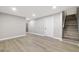 Spacious basement area with laminate flooring and stairs at 334 S Revere St, Aurora, CO 80012
