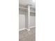 Neutral carpet and trim and a partial storage area with a column and shelving add function to this basement at 334 S Revere St, Aurora, CO 80012
