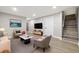 Finished basement with recessed lighting, plush seating, and a stairway at 334 S Revere St, Aurora, CO 80012
