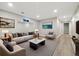 Finished basement with recessed lighting, plush seating, and contemporary decor at 334 S Revere St, Aurora, CO 80012