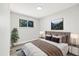 Comfortable bedroom featuring a modern headboard, stylish lighting, and a peaceful window view at 334 S Revere St, Aurora, CO 80012