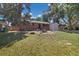 Charming brick home with an attached garage, mature trees, and a well-maintained front yard at 334 S Revere St, Aurora, CO 80012