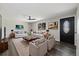 Bright living room featuring hardwood floors, comfortable seating, and stylish decor at 334 S Revere St, Aurora, CO 80012