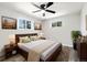 Comfortable bedroom featuring a ceiling fan, ample closet space, and natural light at 334 S Revere St, Aurora, CO 80012