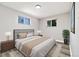 Comfortable bedroom featuring two windows, closet space, and natural light at 334 S Revere St, Aurora, CO 80012