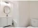 Bright bathroom featuring updated vanity, modern lighting, and clean fixtures at 1764 W Atlantic Pl, Denver, CO 80223