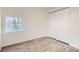 Cozy bedroom with new flooring, a bright window, and a spacious closet at 1764 W Atlantic Pl, Denver, CO 80223