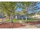 Charming home featuring a lush front yard, mature trees, and inviting curb appeal at 1764 W Atlantic Pl, Denver, CO 80223