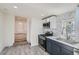 Stylish kitchen with stainless steel appliances, tiled backsplash, and modern cabinetry at 1764 W Atlantic Pl, Denver, CO 80223