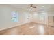 Bright living room featuring updated flooring, fresh paint, and new light fixtures at 1764 W Atlantic Pl, Denver, CO 80223